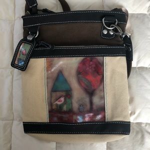 A Sherpani canvas crossbody bag